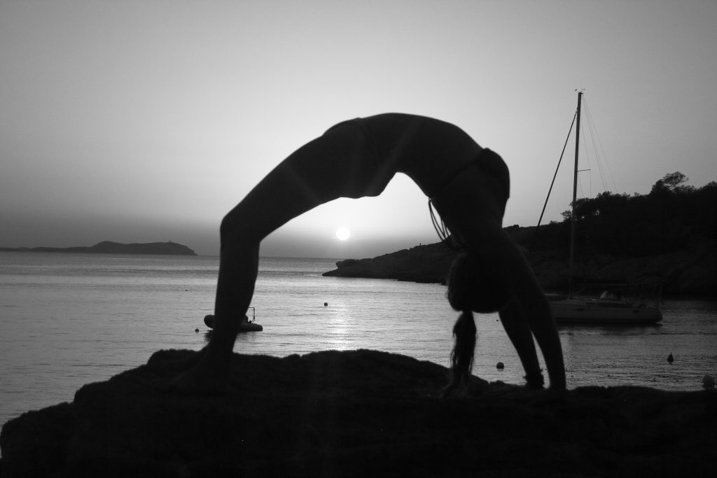 Lauri Berkhoudt wheel pose black and white, yoga retreat Ibiza
